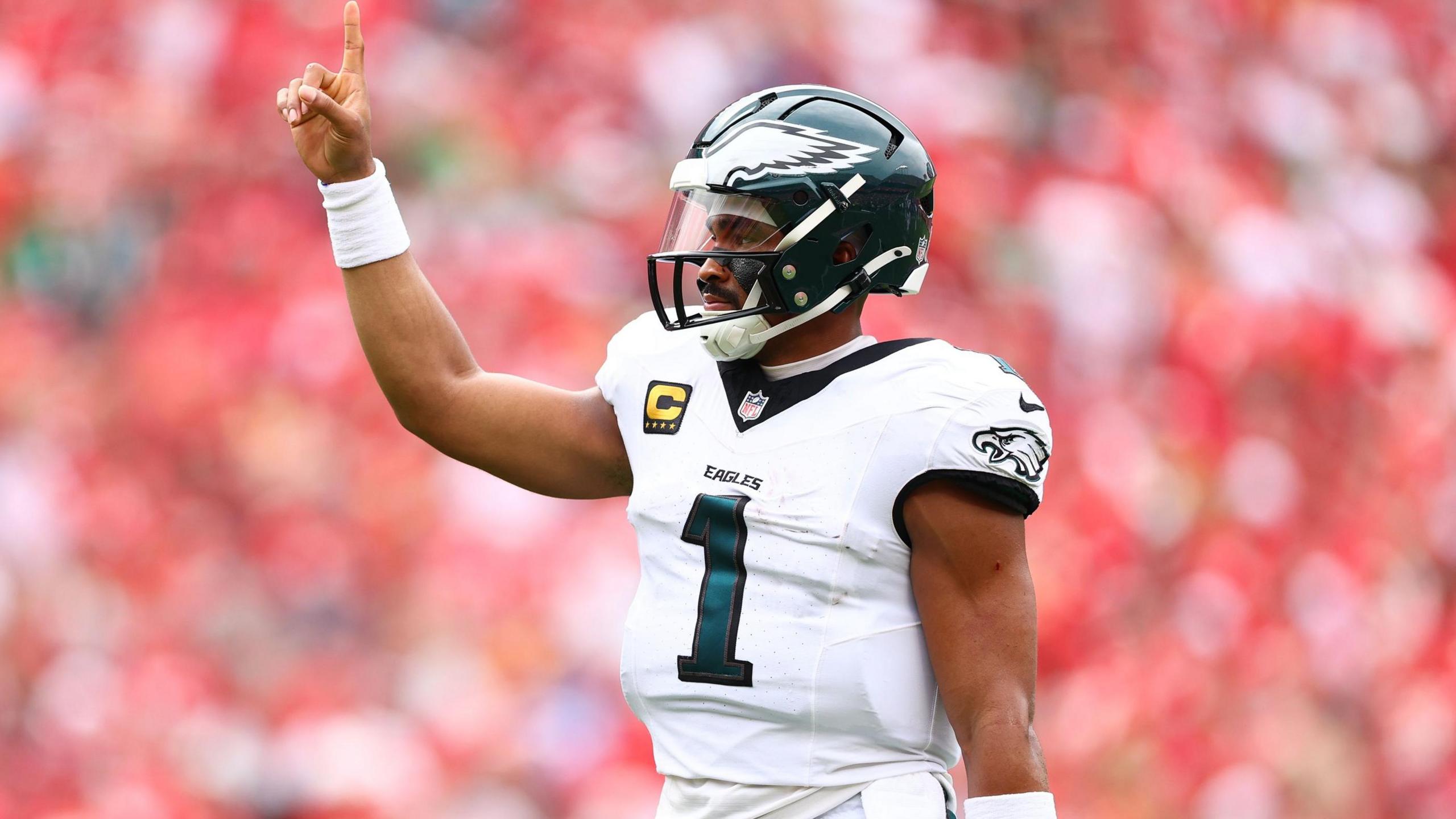 Jalen Hurts raises his hand after the Kansas City Chiefs lose to the Philadelphia Eagles in the NFL
