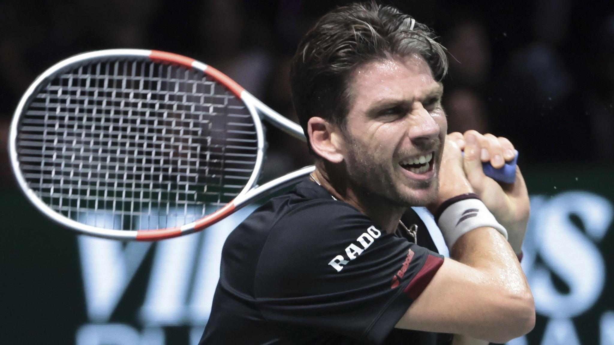 Cameron Norrie hits a backhand