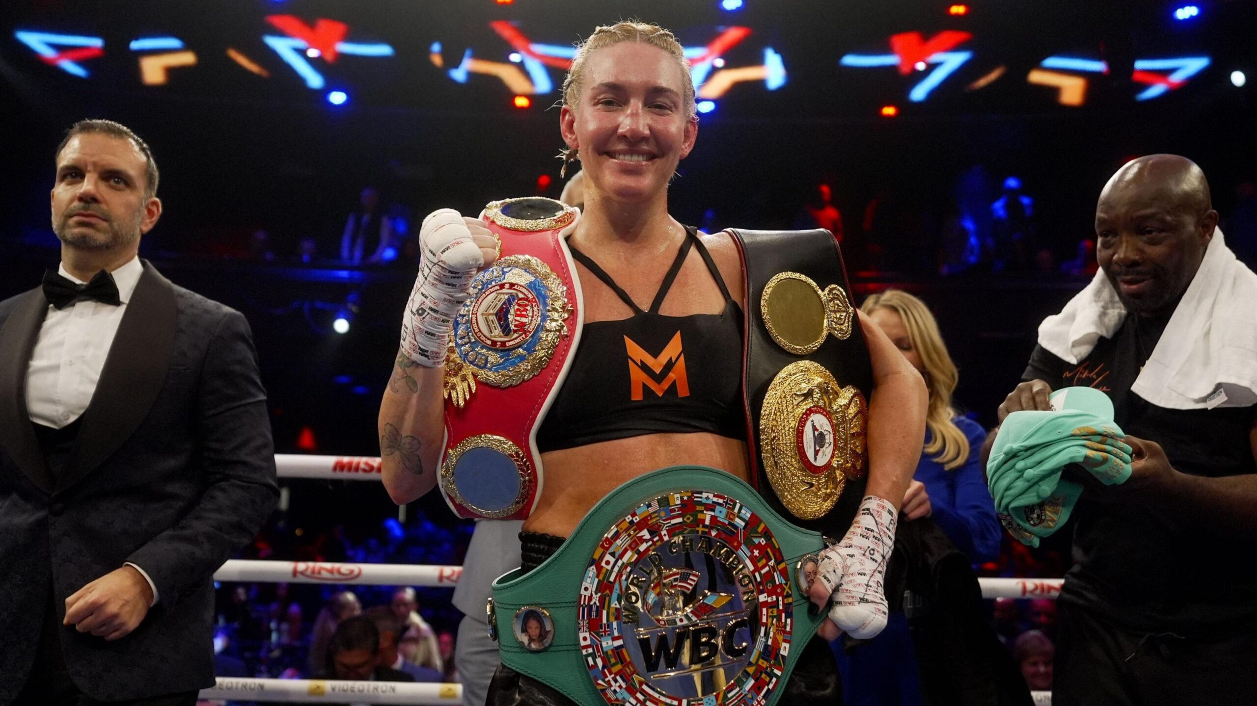 Mikaela Mayer celebrates with her new belts in Canada
