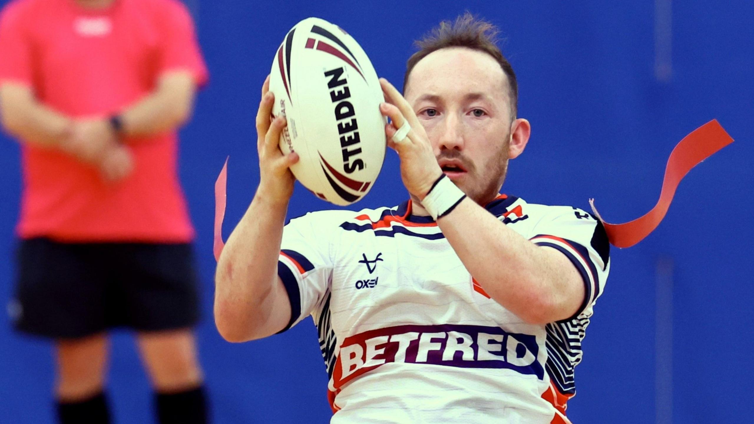 Nathan Collins holds the ball