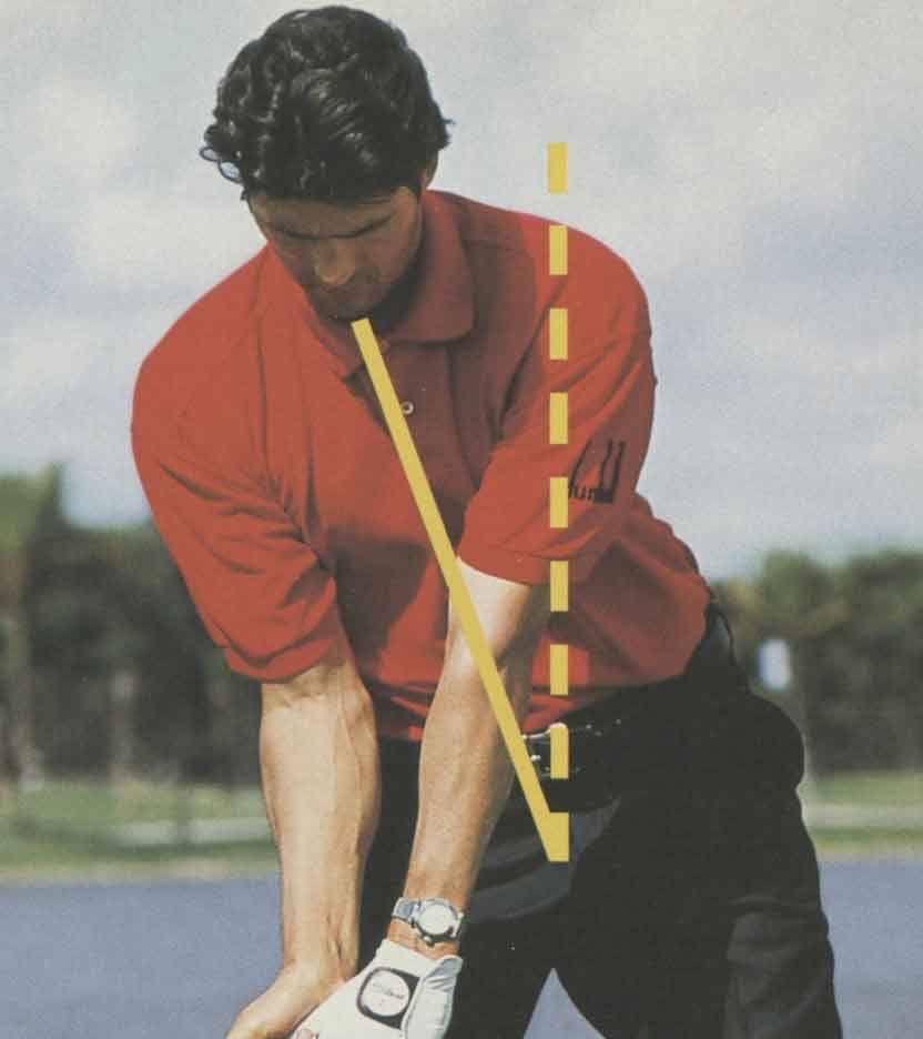 golfer in red shirt demonstrates power angle