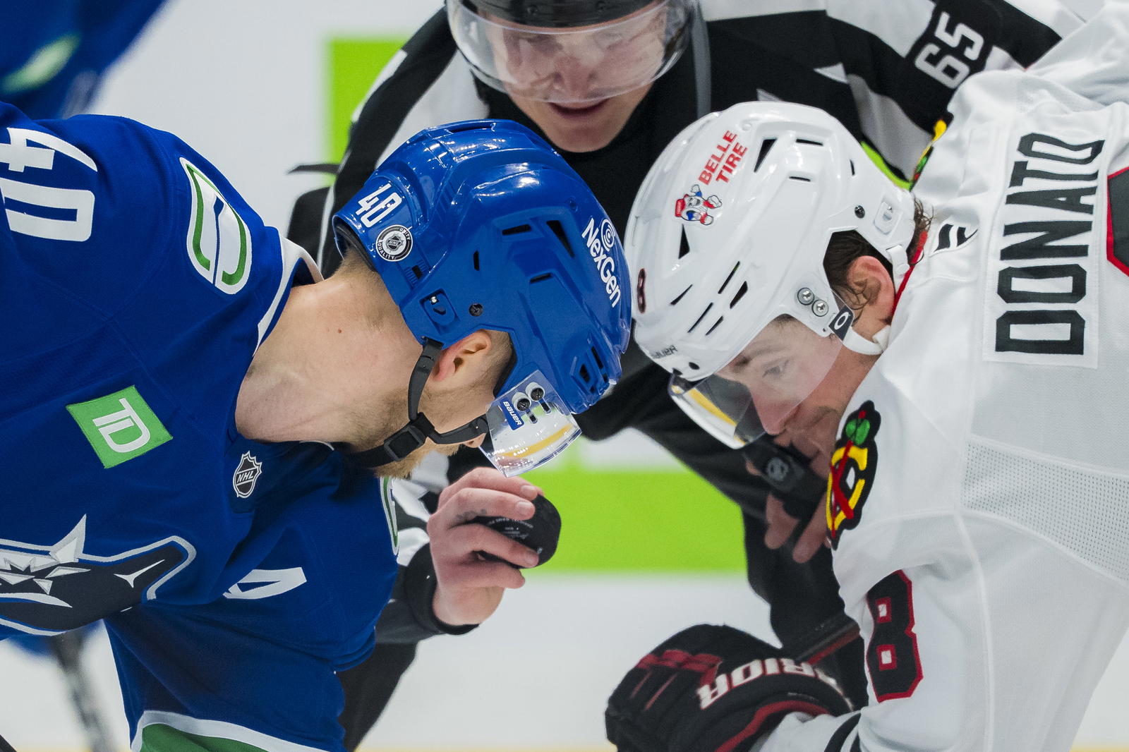 Mar 15, 2025; Vancouver, British Columbia, CAN; Vancouver Canucks forward Elias Pettersson (40) faces off against Chicago Blackhawks forward Ryan Donato (8) in the third period at Rogers Arena. Mandatory Credit: Bob Frid-Imagn Images