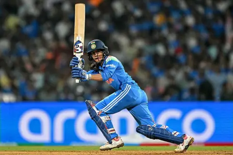 PUNIT PARANJPE/AFP via Getty Images India's Jemimah Rodrigues plays a shot during the ICC Women's Cricket World Cup 2025 one-day international (ODI) semi-final match between India and Australia at the DY Patil Stadium in Navi Mumbai on October 30, 2025. (Photo by Punit PARANJPE / AFP) / -- IMAGE RESTRICTED TO EDITORIAL USE - STRICTLY NO COMMERCIAL USE -- (Photo by PUNIT PARANJPE/AFP via Getty Images)