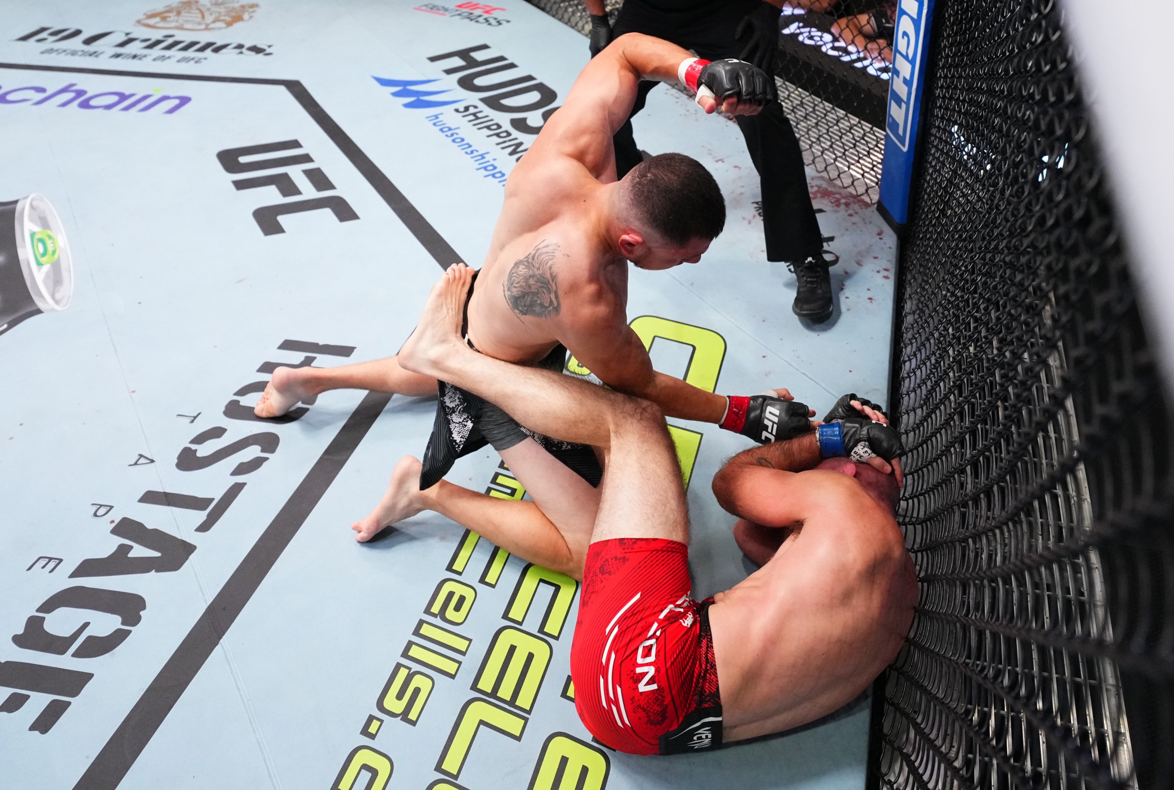 LAS VEGAS, NEVADA - SEPTEMBER 07: (L-R) Steve Garcia punches Kyle Nelson of Canada in a featherweight fight during the UFC Fight Night event at UFC APEX on September 07, 2024 in Las Vegas, Nevada. (Photo by Chris Unger/Zuffa LLC via Getty Images)