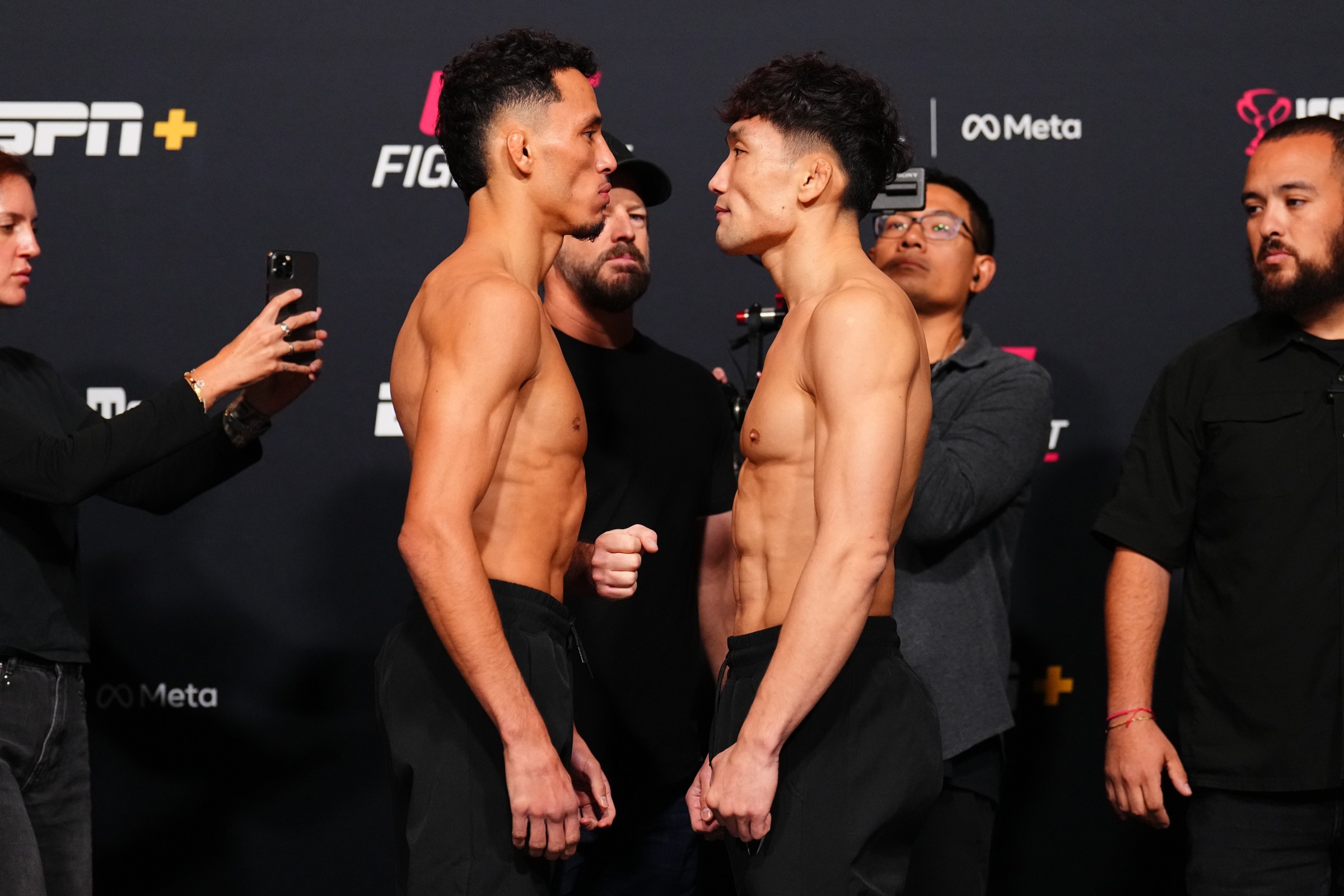 LAS VEGAS, NEVADA - OCTOBER 31: (L-R) Opponents Timmy Cuamba and ChangHo Lee of South Korea face off during the UFC Fight Night weigh-in at UFC APEX on October 31, 2025 in Las Vegas, Nevada. (Photo by Chris Unger/Zuffa LLC)
